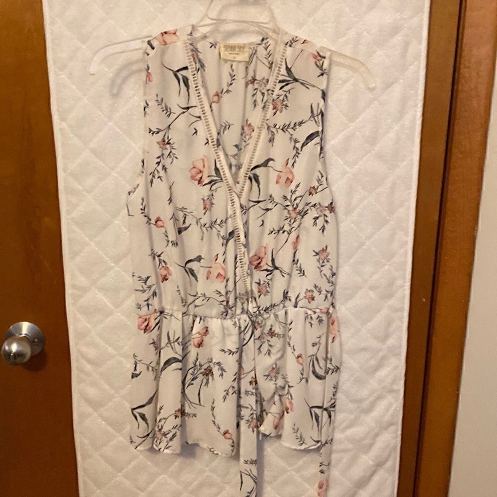 Sheer
print sleeveless top with side tie